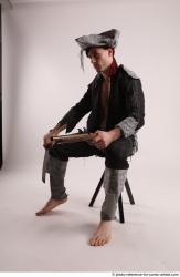 JACK PIRATE SITTING POSE WITH GUN AND DAGGER